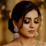 Radiant Floral CZ Stone Jhumka Earrings blue